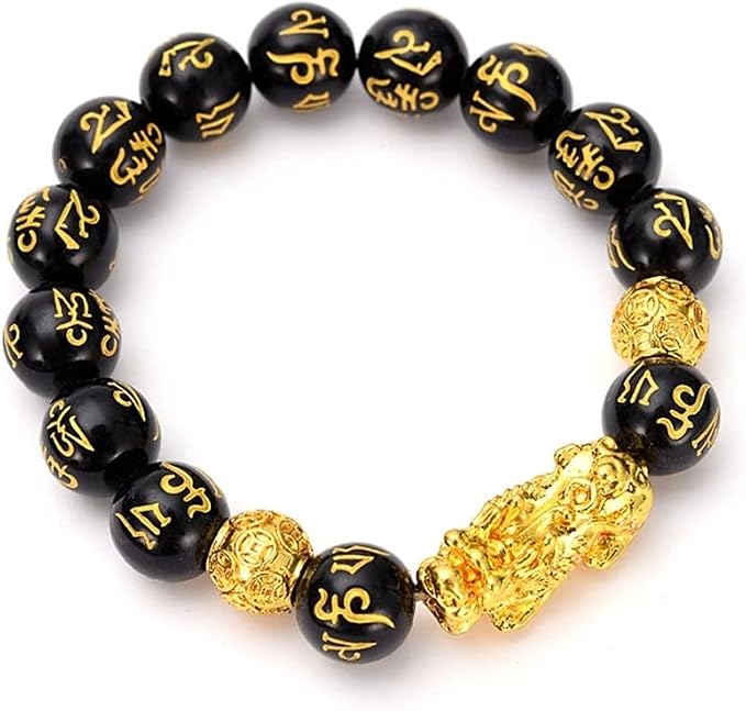 Black obsidian Pixiu bracelet held in hand - lifestyle shot